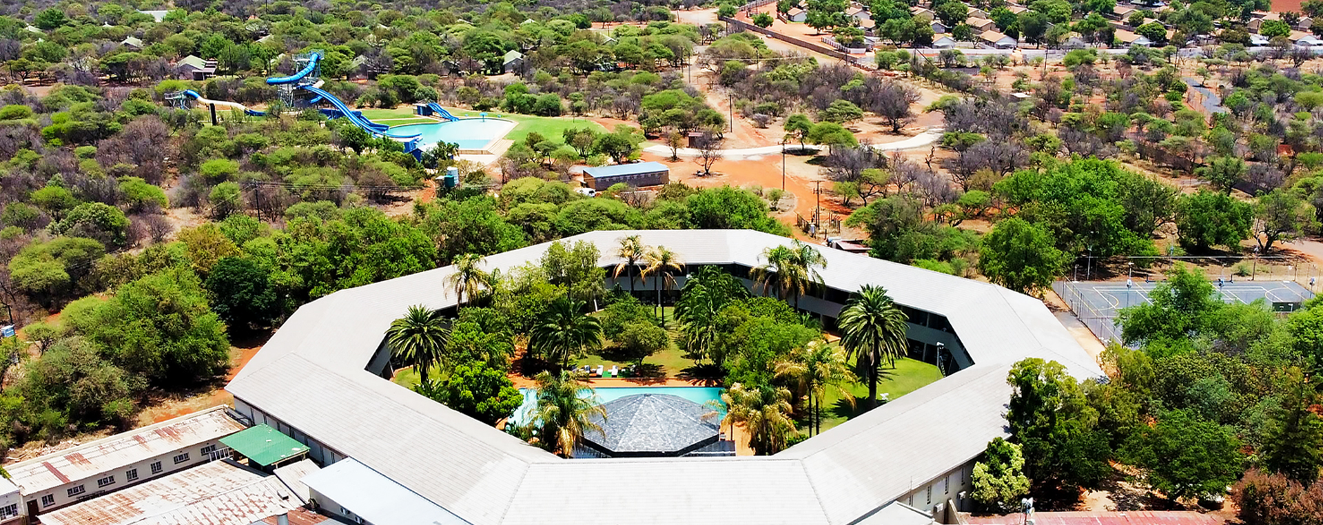 Aerial view of Sundown Country Estate accommodation near Sun City with chalets hotel grounds and waterpark
