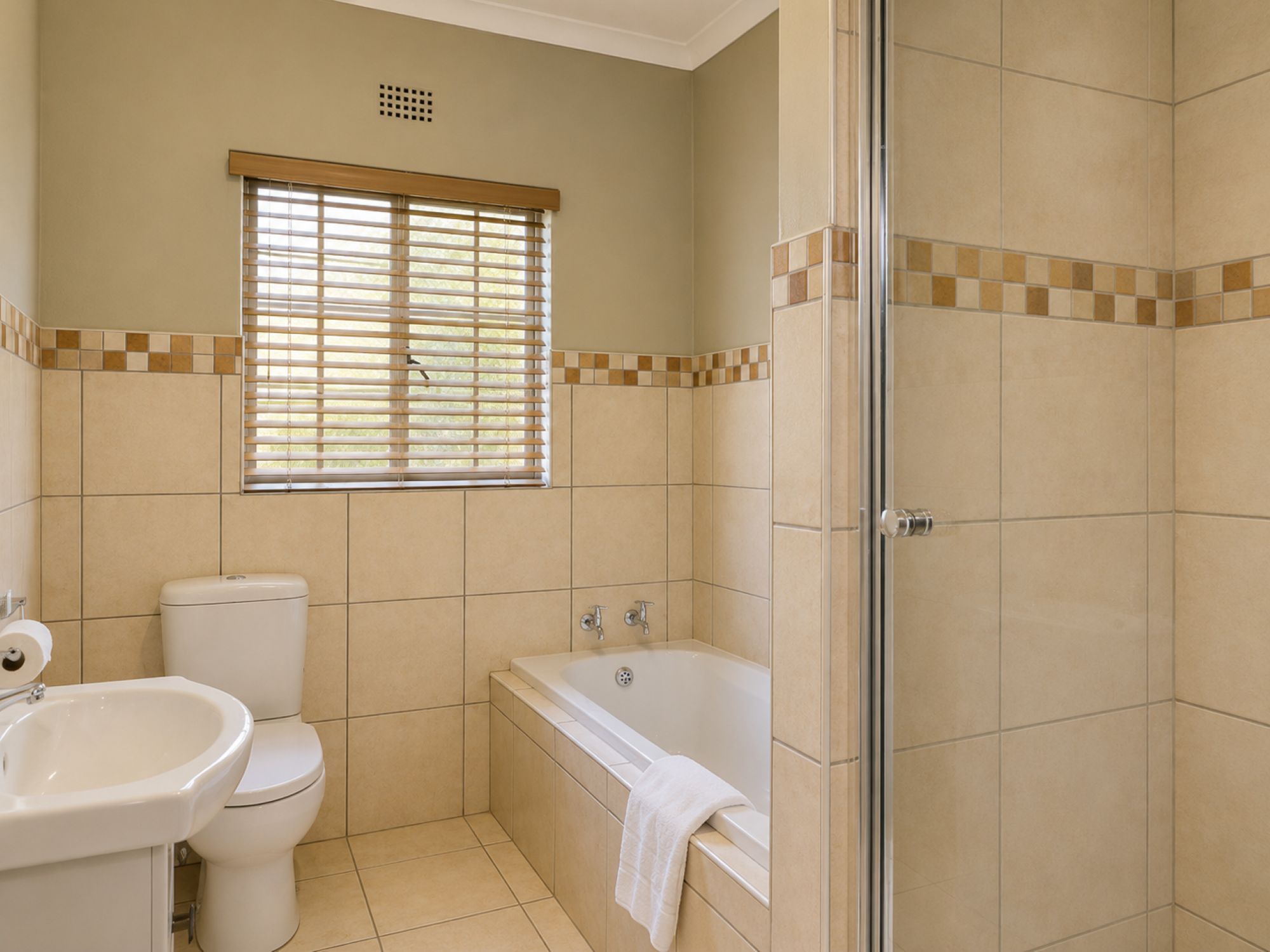 Executive Two-Bedroom Self-Catering Chalet bathroom near Sun City at Sundown Country Estate
