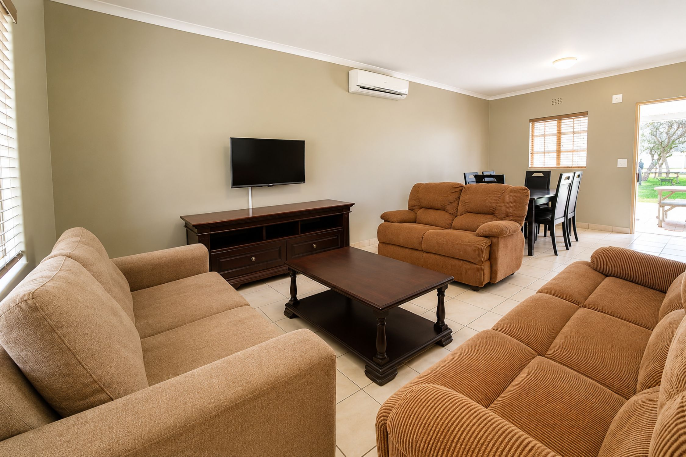 Executive Two-Bedroom Chalet lounge and dining area near Sun City