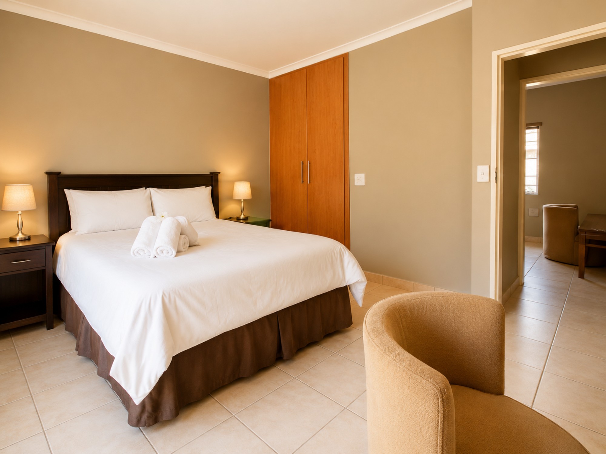 Executive Two-Bedroom Chalet main bedroom near Pilanesberg and Sun City