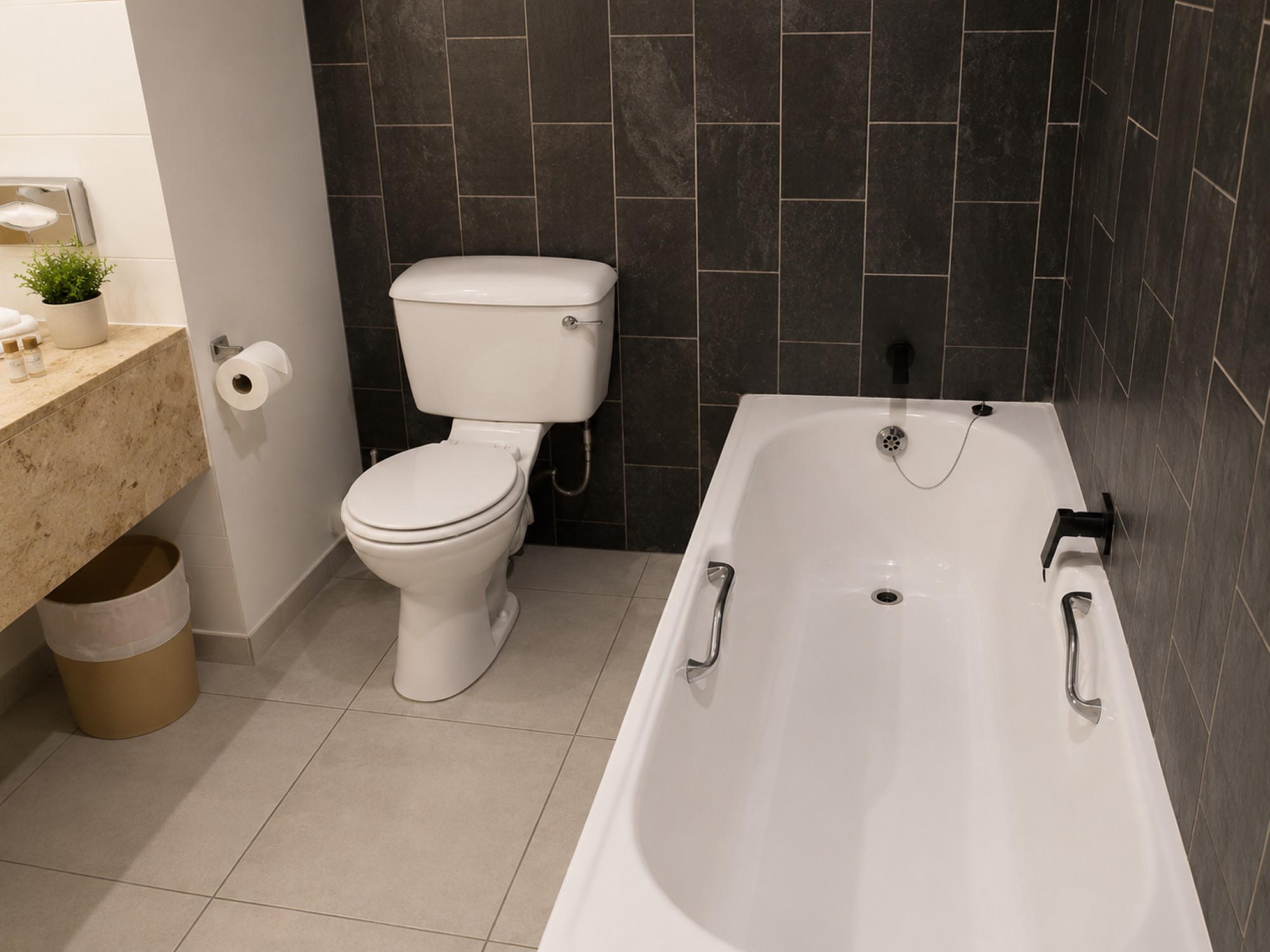 Family Suite bathroom with bath near Sun City