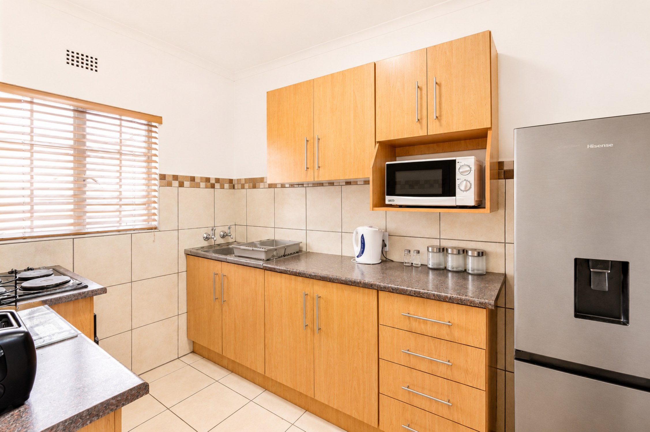 Kitchen in the Standard Two-Bedroom Self-Catering Chalet near Sun City