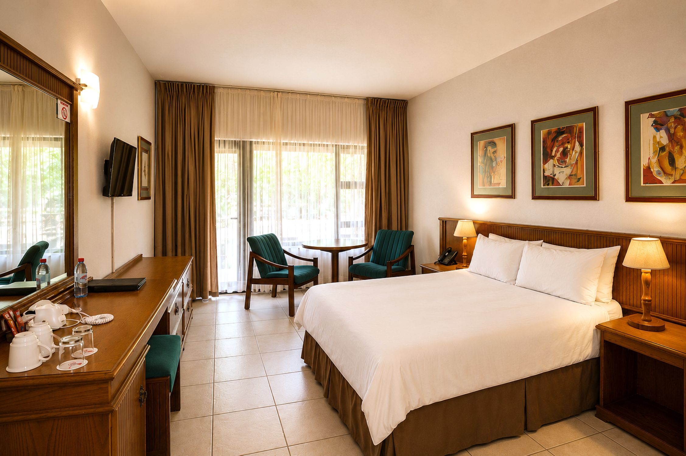 Standard Double Room bedroom near Sun City with TV and seating area