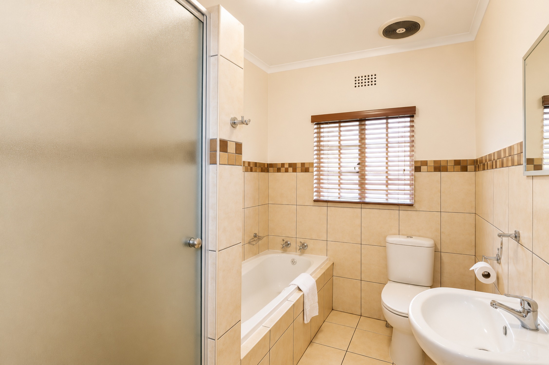 Standard Two-Bedroom Self-Catering Chalet bathroom near Sun City at Sundown Country Estate